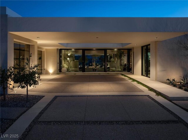 doorway to property with stucco siding