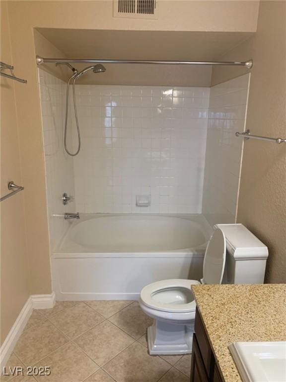 bathroom featuring vanity, visible vents, tile patterned flooring, shower / washtub combination, and toilet