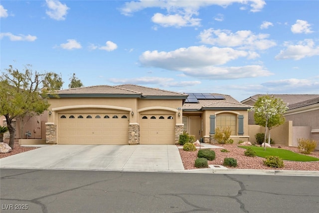 view of front facade featuring a garage, stone siding, driveway, and stucco siding