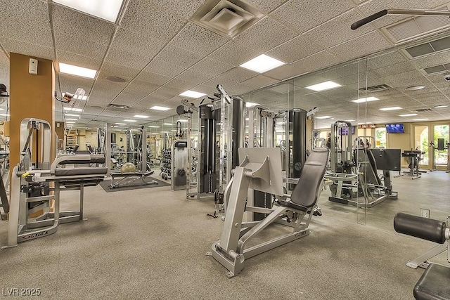 workout area featuring a paneled ceiling and visible vents