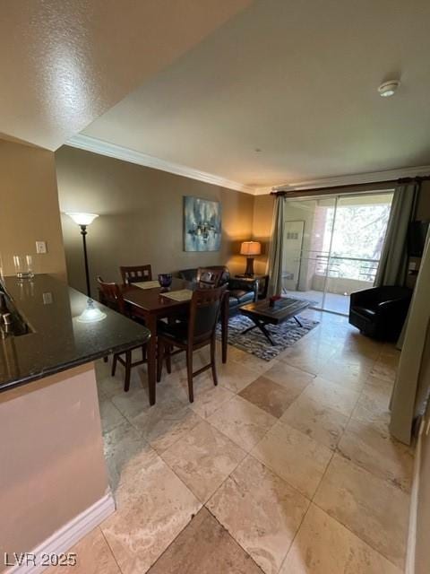 dining area with crown molding