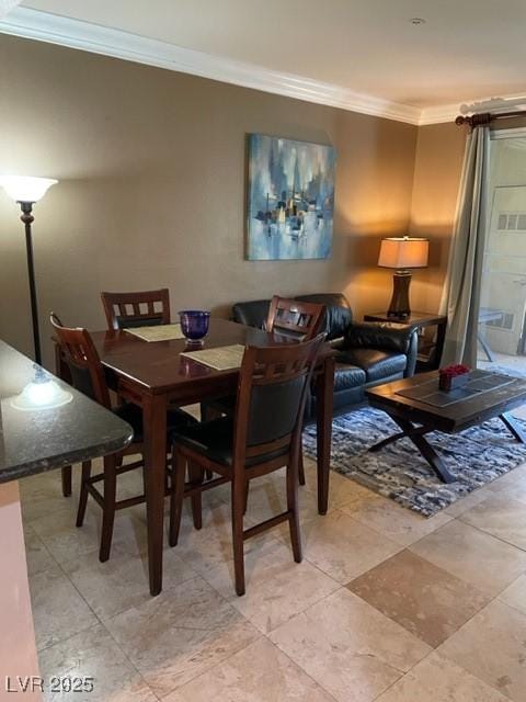 dining area featuring crown molding