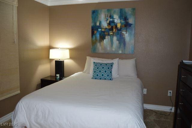 carpeted bedroom featuring baseboards