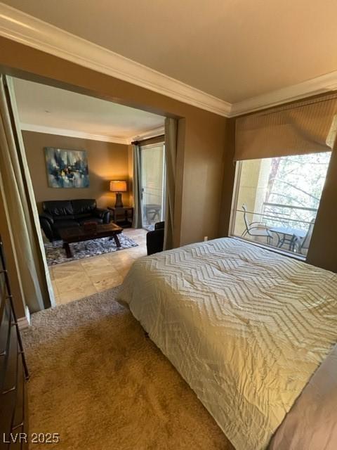 bedroom featuring crown molding and carpet