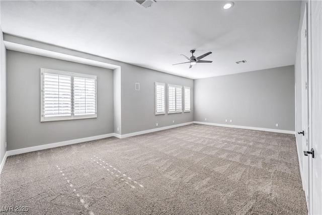 empty room featuring visible vents, baseboards, carpet floors, and ceiling fan