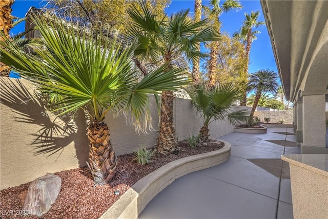 view of patio / terrace featuring fence