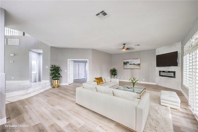 8864 La Manga Ave, Las Vegas, NV 89147 - living area with light wood-type flooring, a ceiling fan, and visible vents
