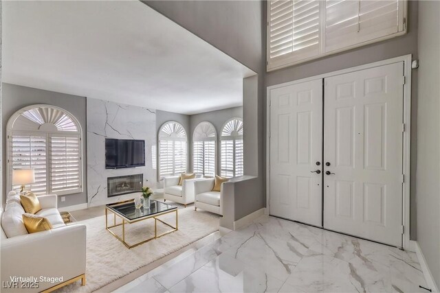 8864 La Manga Ave, Las Vegas, NV 89147 - interior space featuring marble finish floor, baseboards, and a high end fireplace