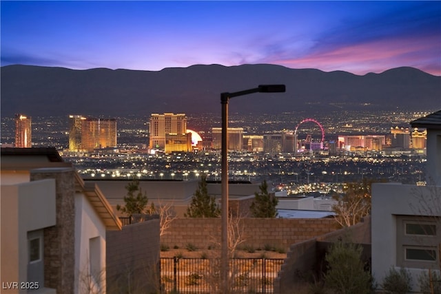 property's view of city featuring a mountain view