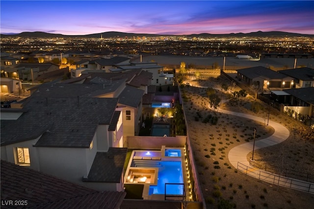 bird's eye view featuring a mountain view and a residential view