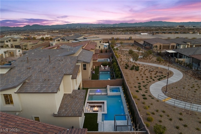 birds eye view of property featuring a mountain view and a residential view