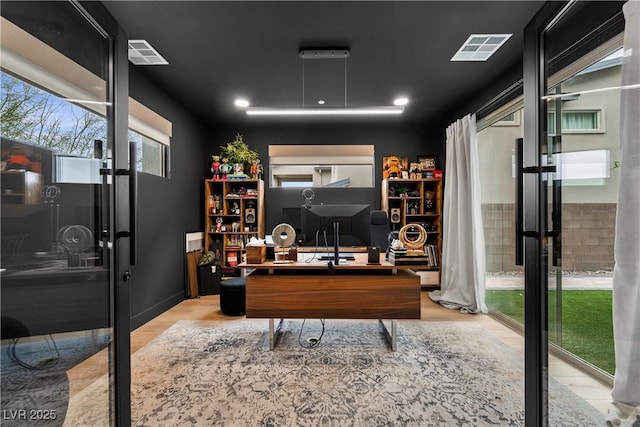 office space featuring visible vents and wood finished floors