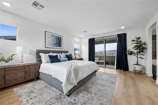 bedroom with access to exterior, recessed lighting, visible vents, and light wood-type flooring