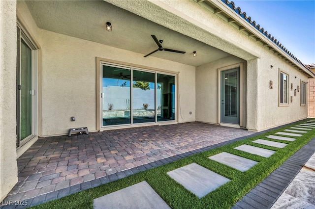 view of patio featuring ceiling fan