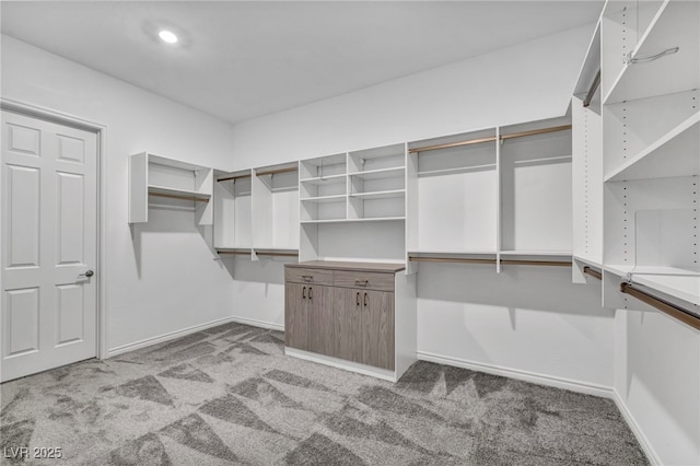 spacious closet featuring carpet floors