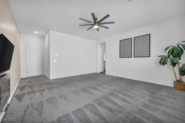 unfurnished living room featuring baseboards, carpet, and a ceiling fan