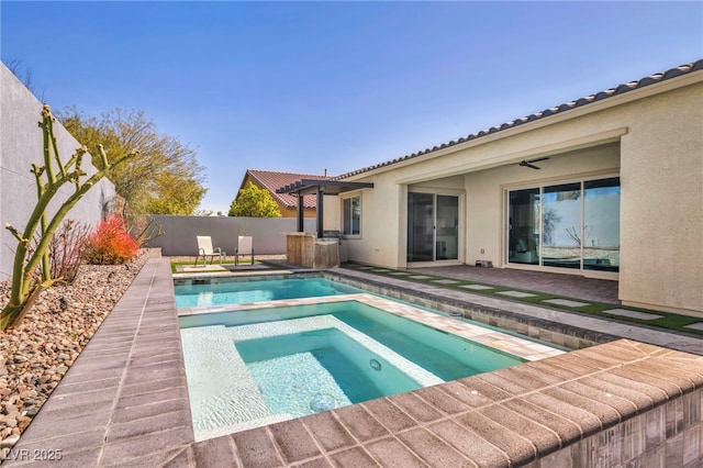 view of swimming pool with a patio, a ceiling fan, a fenced in pool, an in ground hot tub, and a fenced backyard