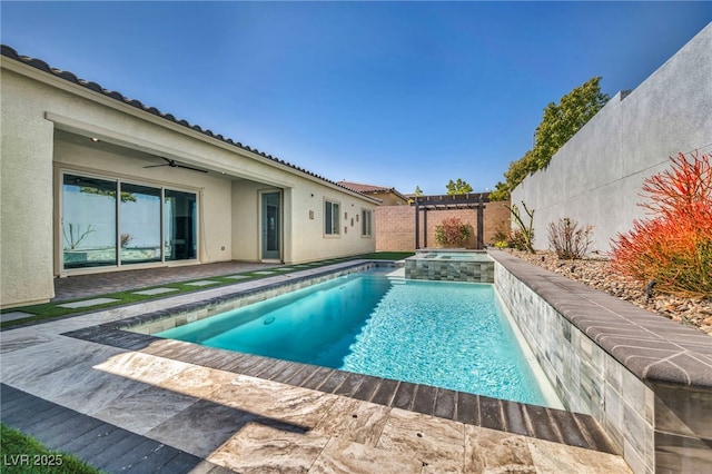 view of pool with a patio area, a fenced backyard, a pool with connected hot tub, and a ceiling fan