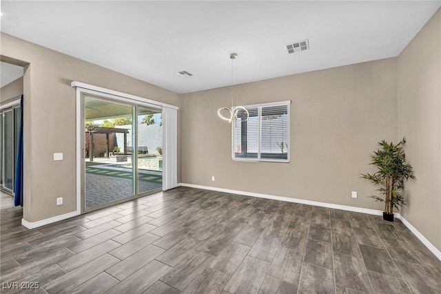 unfurnished room featuring visible vents, baseboards, and dark wood-style flooring