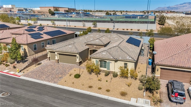 birds eye view of property featuring a mountain view and a residential view