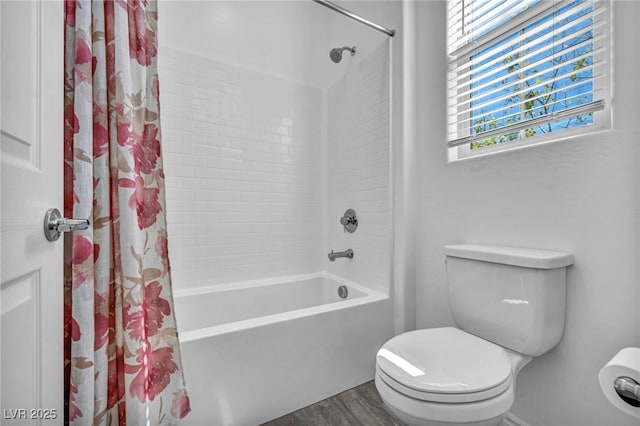 bathroom with toilet, wood finished floors, and shower / bath combination with curtain