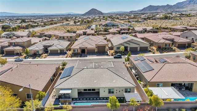 birds eye view of property featuring a mountain view and a residential view