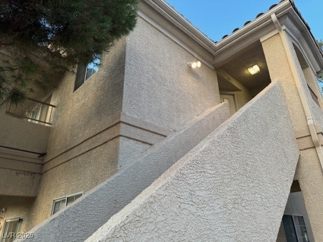 view of side of property featuring stucco siding