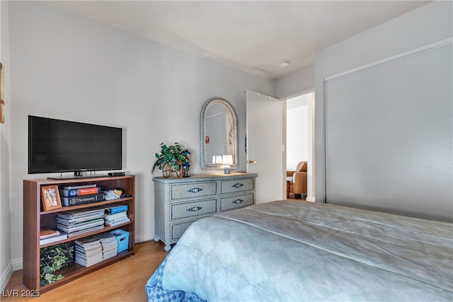 bedroom featuring wood finished floors