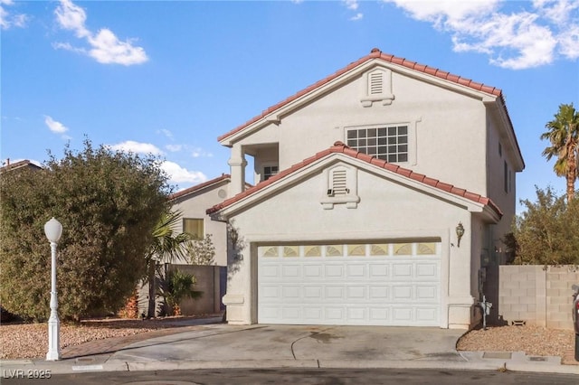 mediterranean / spanish-style home featuring stucco siding, a tiled roof, concrete driveway, and a garage