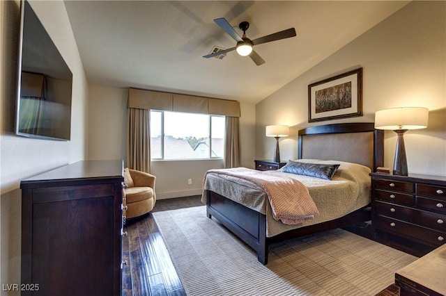 bedroom with dark wood-style flooring, baseboards, a ceiling fan, and vaulted ceiling