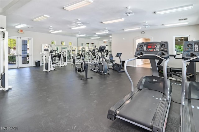 gym featuring a wealth of natural light, french doors, visible vents, and ceiling fan