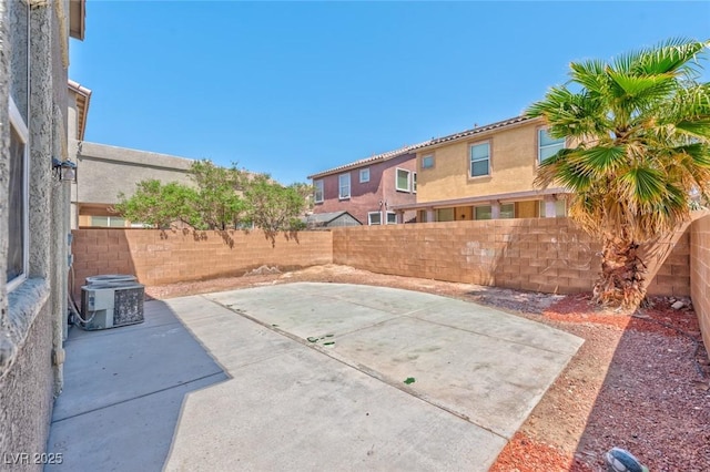 view of patio with central air condition unit and a fenced backyard