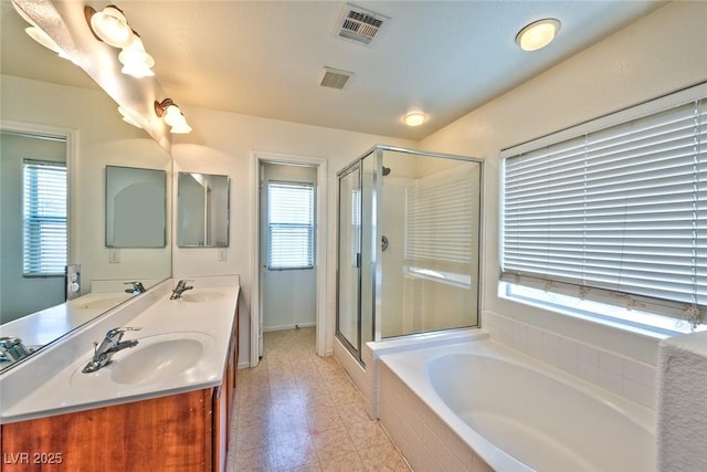 bathroom with a sink, visible vents, and a wealth of natural light