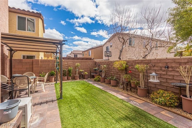 view of yard with a patio, a fenced backyard, and a pergola