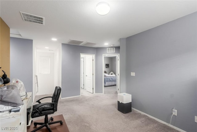 office space featuring carpet, visible vents, and baseboards