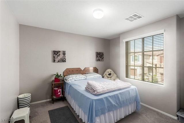 bedroom with carpet flooring, baseboards, and visible vents