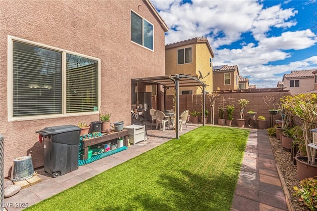 view of yard with a patio area, a pergola, and fence