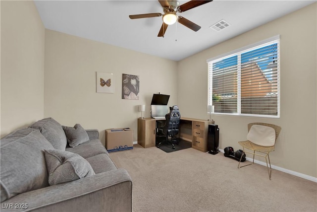 carpeted office featuring a ceiling fan, baseboards, and visible vents