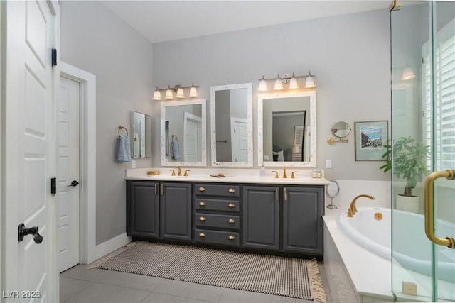 bathroom featuring a sink, a bath, double vanity, and tile patterned flooring