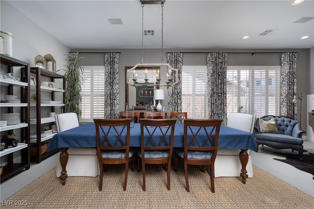 dining room featuring visible vents, recessed lighting, and an inviting chandelier