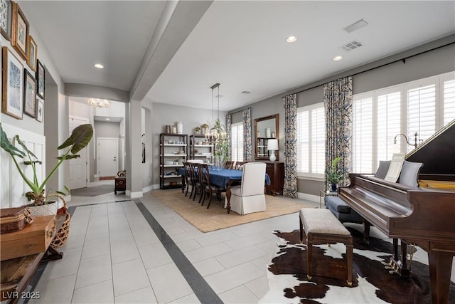 interior space with recessed lighting, visible vents, baseboards, and a notable chandelier