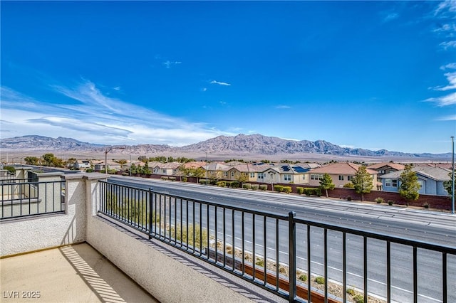 balcony with a mountain view and a residential view