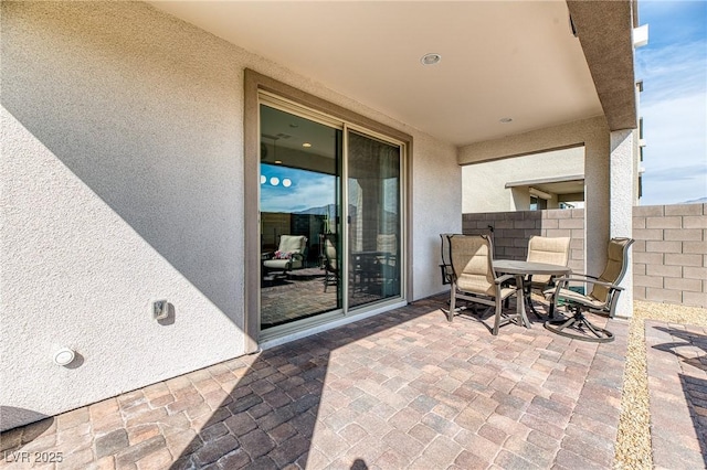 view of patio / terrace featuring fence