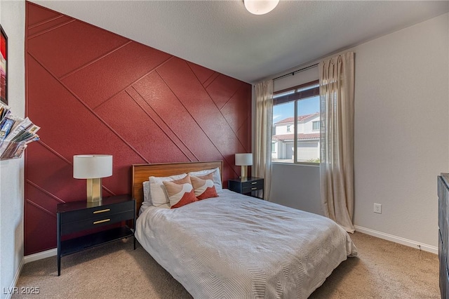 carpeted bedroom with baseboards