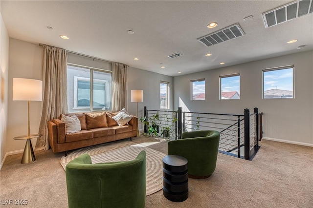 living area with carpet and visible vents