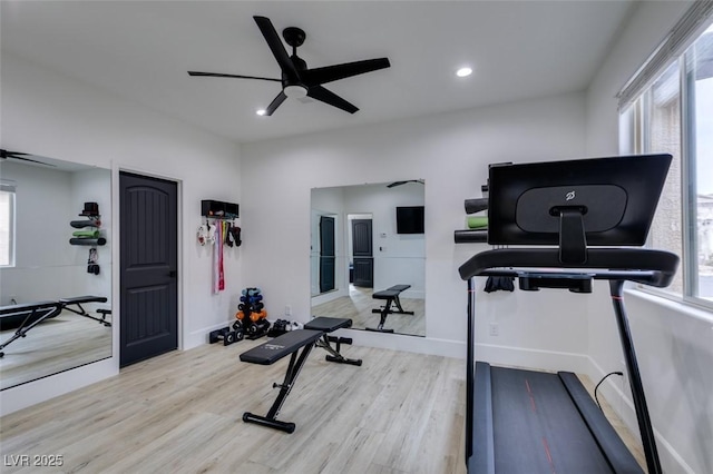 exercise area with wood finished floors, recessed lighting, a ceiling fan, and baseboards