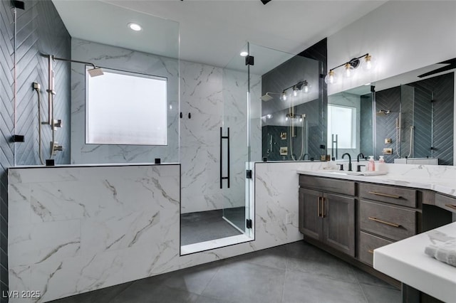 bathroom featuring vanity, recessed lighting, and a marble finish shower