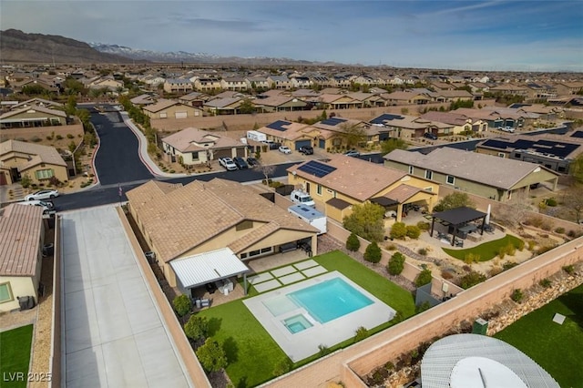 birds eye view of property with a residential view