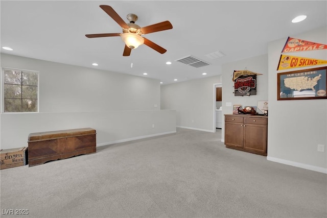 empty room with light carpet, visible vents, recessed lighting, and baseboards