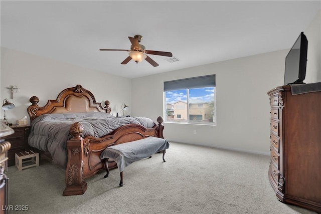 carpeted bedroom with visible vents and a ceiling fan